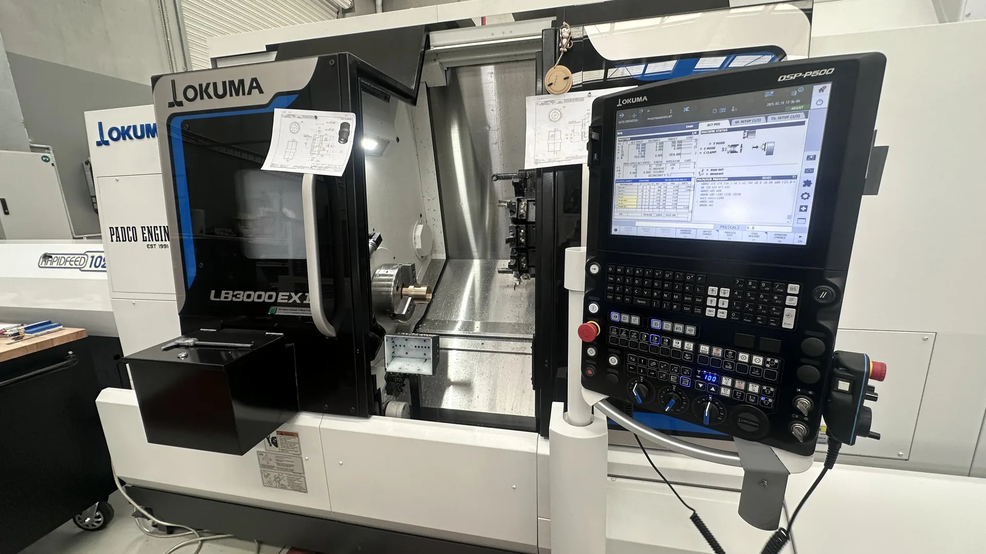CNC lathe interior with shaft and chuck, Padco Engineering workshop