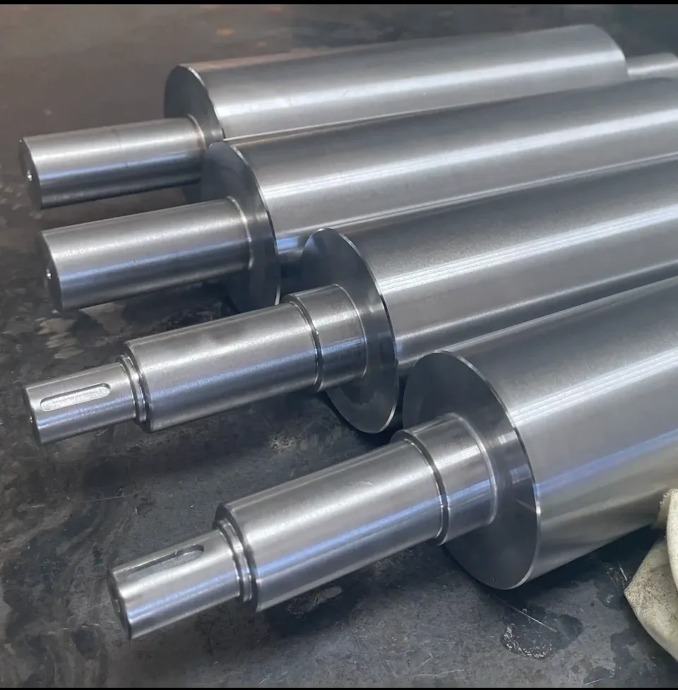 Large diameter polished steel shafts and rollers, manual turning Padco Engineering
