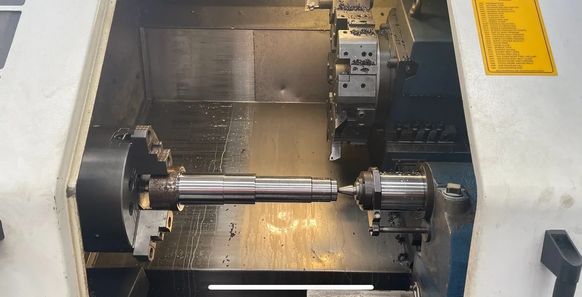 CNC lathe with long splined shaft chucked, Padco Engineering workshop