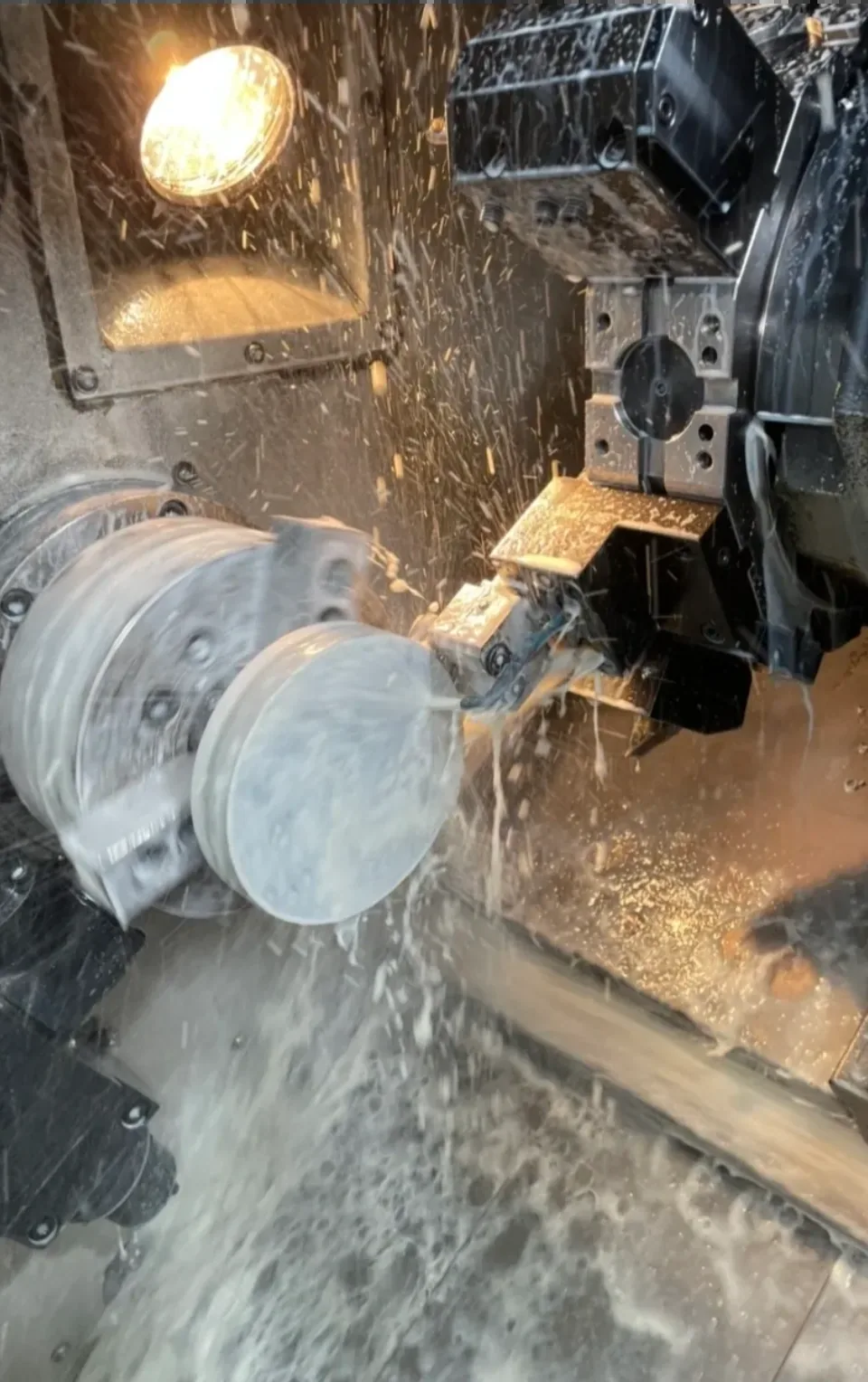 CNC lathe in action with coolant spray, Padco Engineering Pakenham VIC