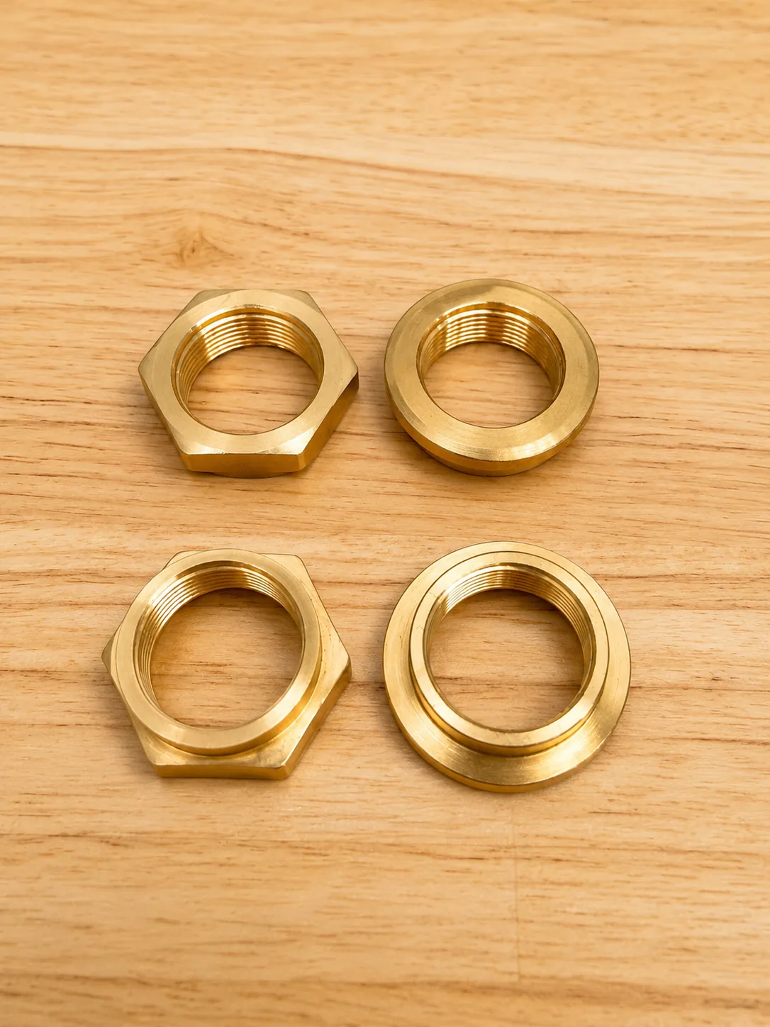 Precision-machined brass hex nuts, flanged bush and threaded fittings, Padco Engineering