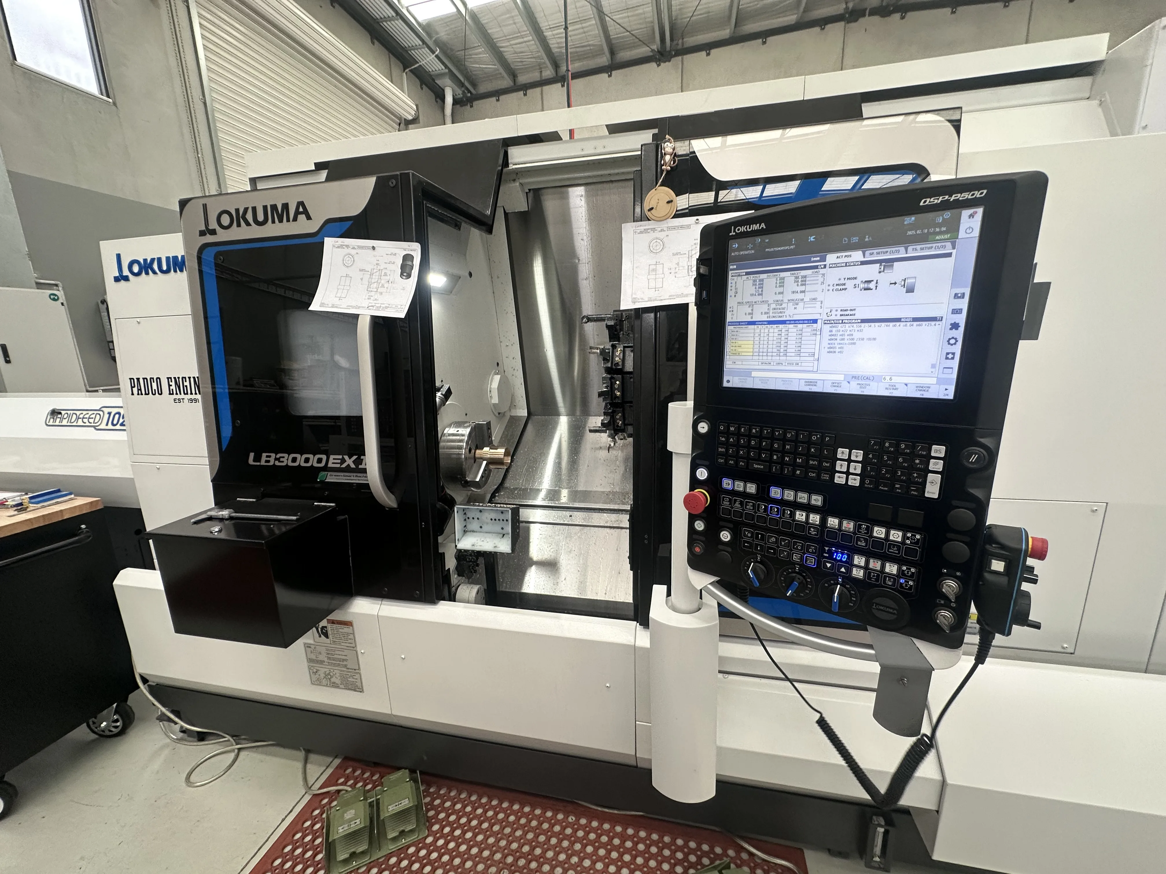 Okuma CNC lathes with Padco Engineering Est 1991 sign, Pakenham workshop